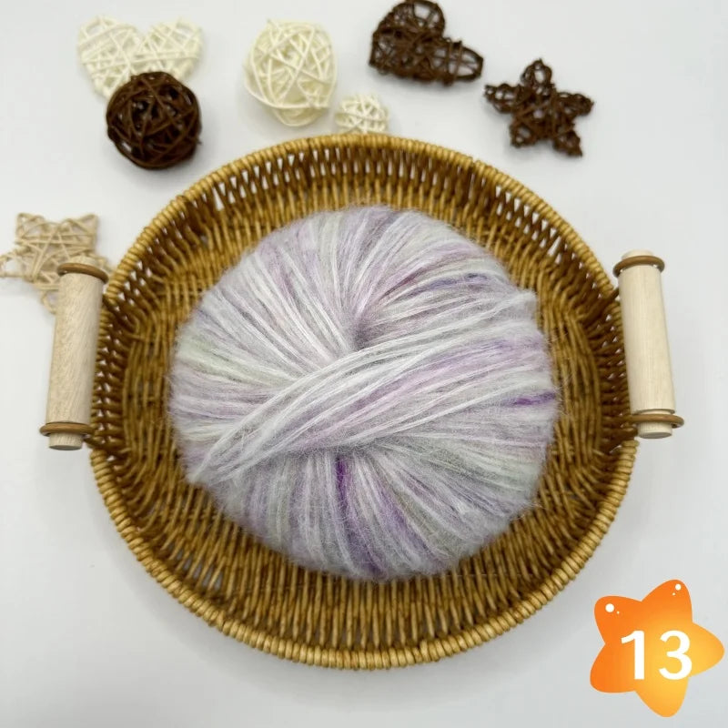 The yarn is a gradient wool-mohair blend with a rainbow segment-dyed medium weight. Each ball weighs 100 grams and is 350 meters