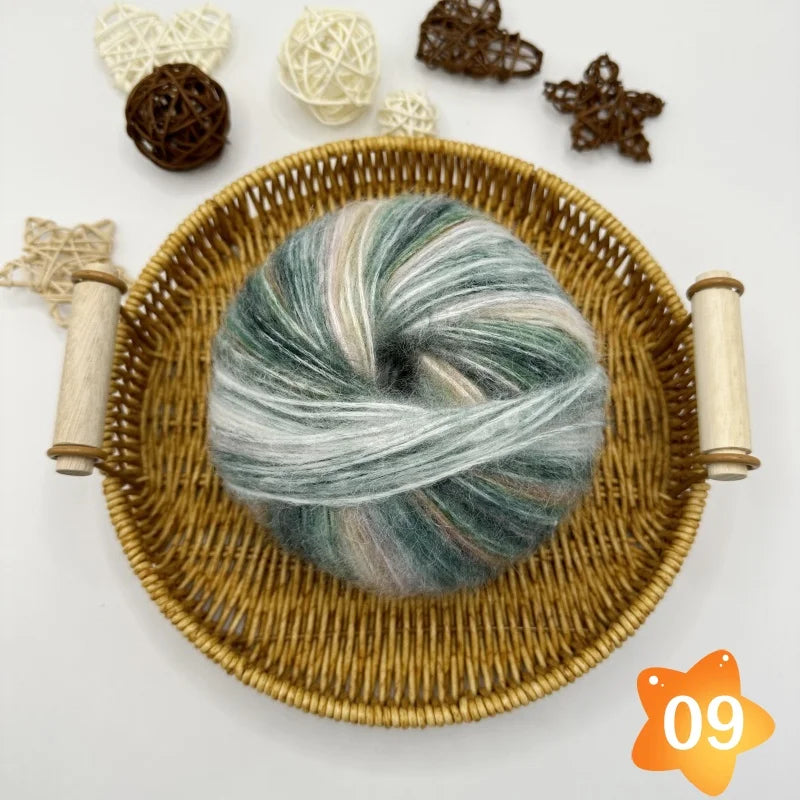 The yarn is a gradient wool-mohair blend with a rainbow segment-dyed medium weight. Each ball weighs 100 grams and is 350 meters