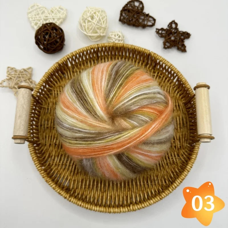 The yarn is a gradient wool-mohair blend with a rainbow segment-dyed medium weight. Each ball weighs 100 grams and is 350 meters